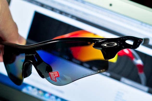 Polarized laser etching on lens.  SGD$450 POLARIZED RADARLOCK™ PATH SKU# OO9181-12 Color: Polished Black/Black Iridium Polarized & VR28 Black Iridium